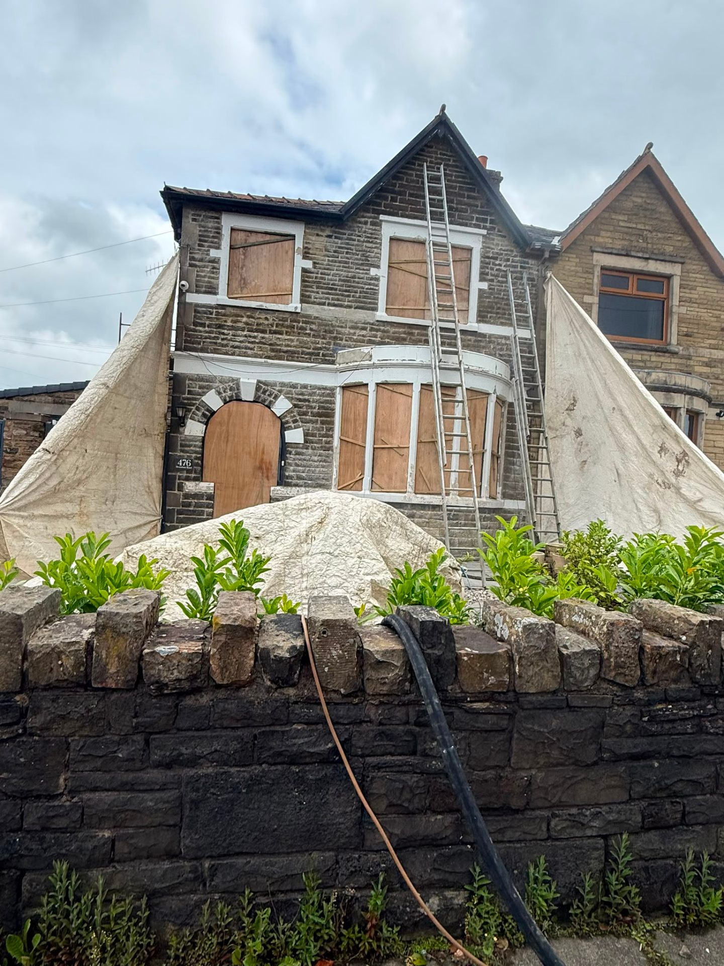 Stone terrace sheeted and prepared for blast cleaning in Lancashire